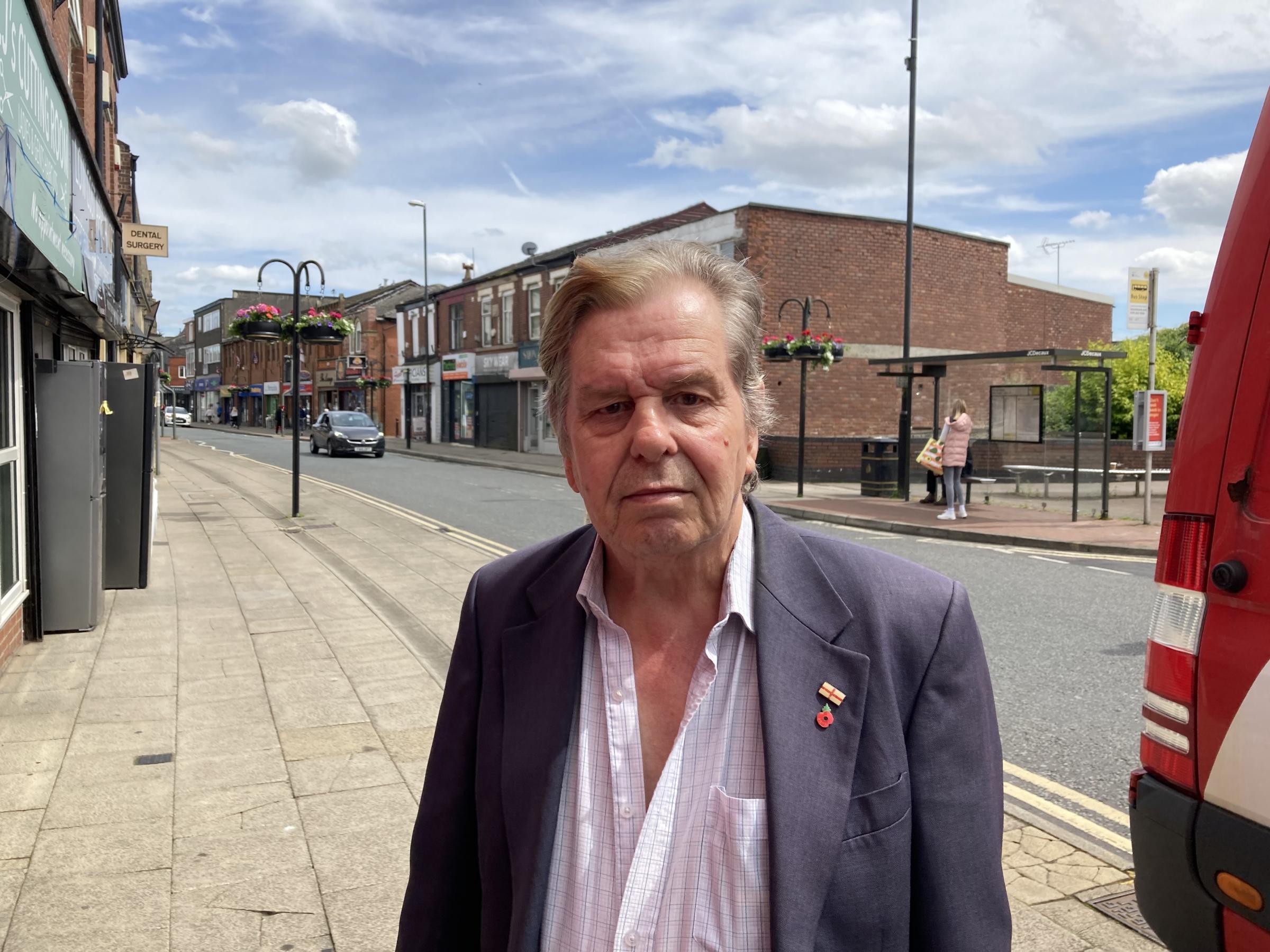 Phil Brandon walking along Market Street in Heywood (Picture: LDRS)